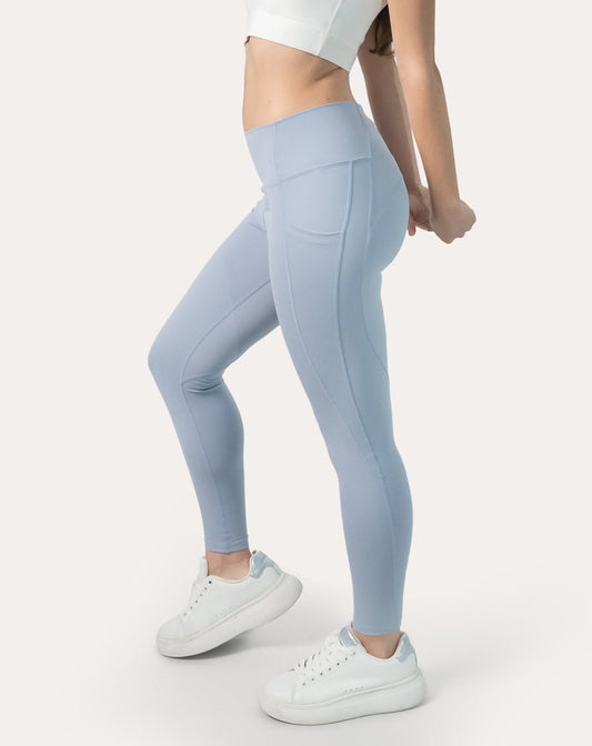 Left three-quarter view of ice blue leggings with phone pocket and high waist