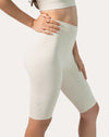 Right side view of ivory bike shorts showing high-waist fit and minimal seams