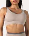 Close-up of scoop-neck longline bra from the light grey gym set, front neckline detail