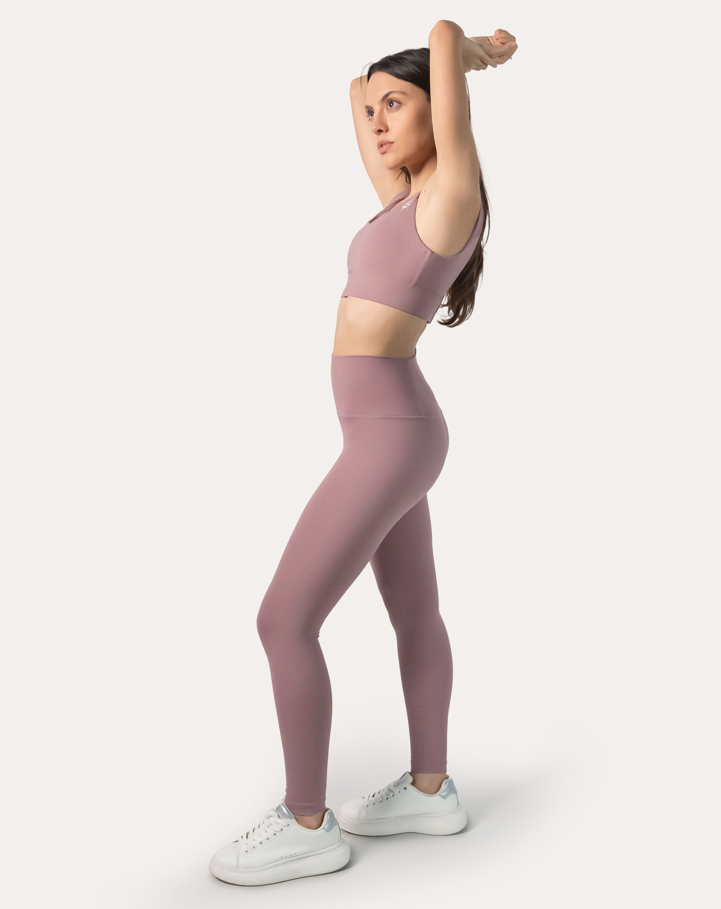 3/4 front of light pink gym leggings and top set; supportive V-neck bra and sculpting leggings
