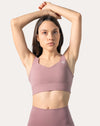 Side close-up of light pink gym leggings and top set showing the wide, smoothing waistband