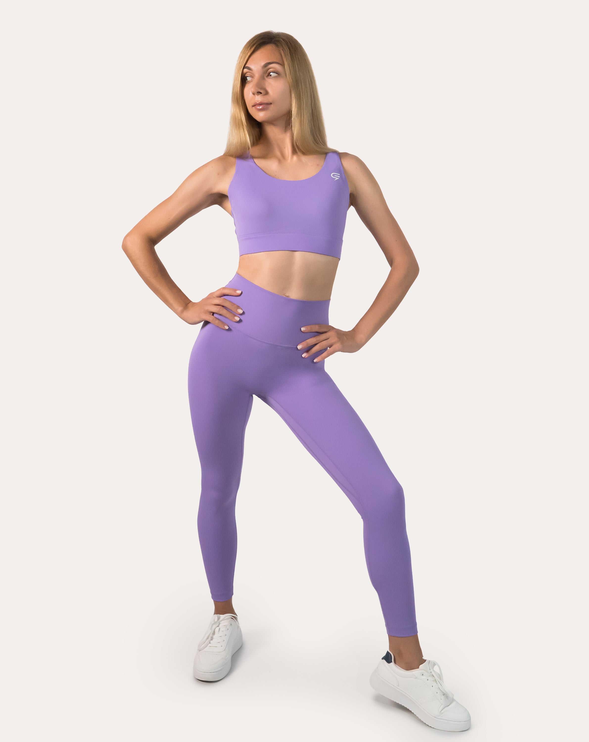 Lilac gym set front view on model: racerback bra and high-waist leggings for women