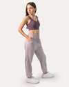 Lilac joggers for women, left three-quarter full-length view with hands in pockets
