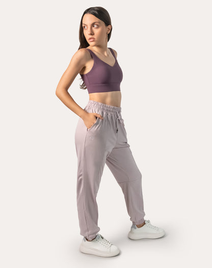Lilac joggers for women, left three-quarter full-length view with hands in pockets