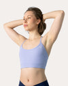 Front view of lilac racerback sports bra with arms raised, thin straps and scoop neckline