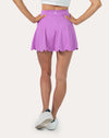 Back view of lilac tennis skirt with shorts with scalloped hem and A-line drape