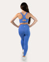 Back view of sapphire blue matching gym set highlighting racerback clasp and keyhole
