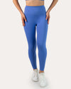 Front detail of leggings from sapphire blue matching gym set showing wide supportive waistband