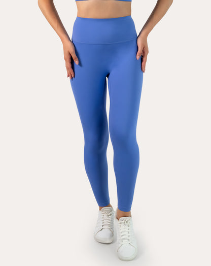 Front detail of leggings from sapphire blue matching gym set showing wide supportive waistband