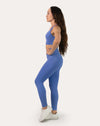 Side view of sapphire blue matching gym set with high-waist leggings and longline bra