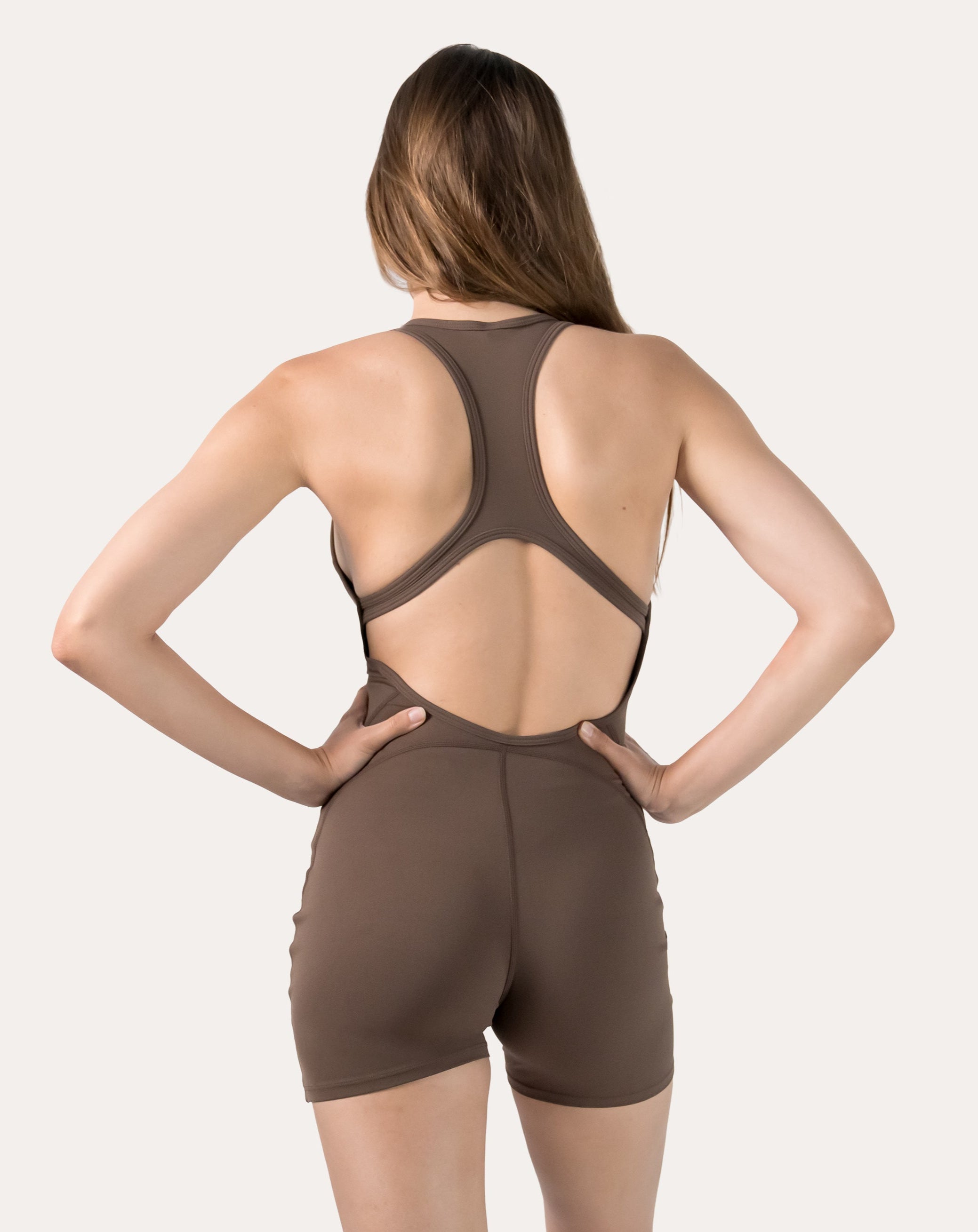 Mocha brown women’s sportswear jumpsuit with racerback; straight back view