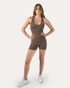 Mocha brown women’s sportswear jumpsuit with racerback; front view, moisture-wicking stretch