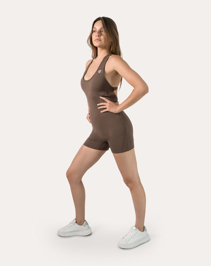 Mocha brown women’s sportswear jumpsuit; right three quarter step stance
