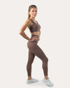 3/4 side profile of mocha gym set highlighting high-waist leggings and sleek fit