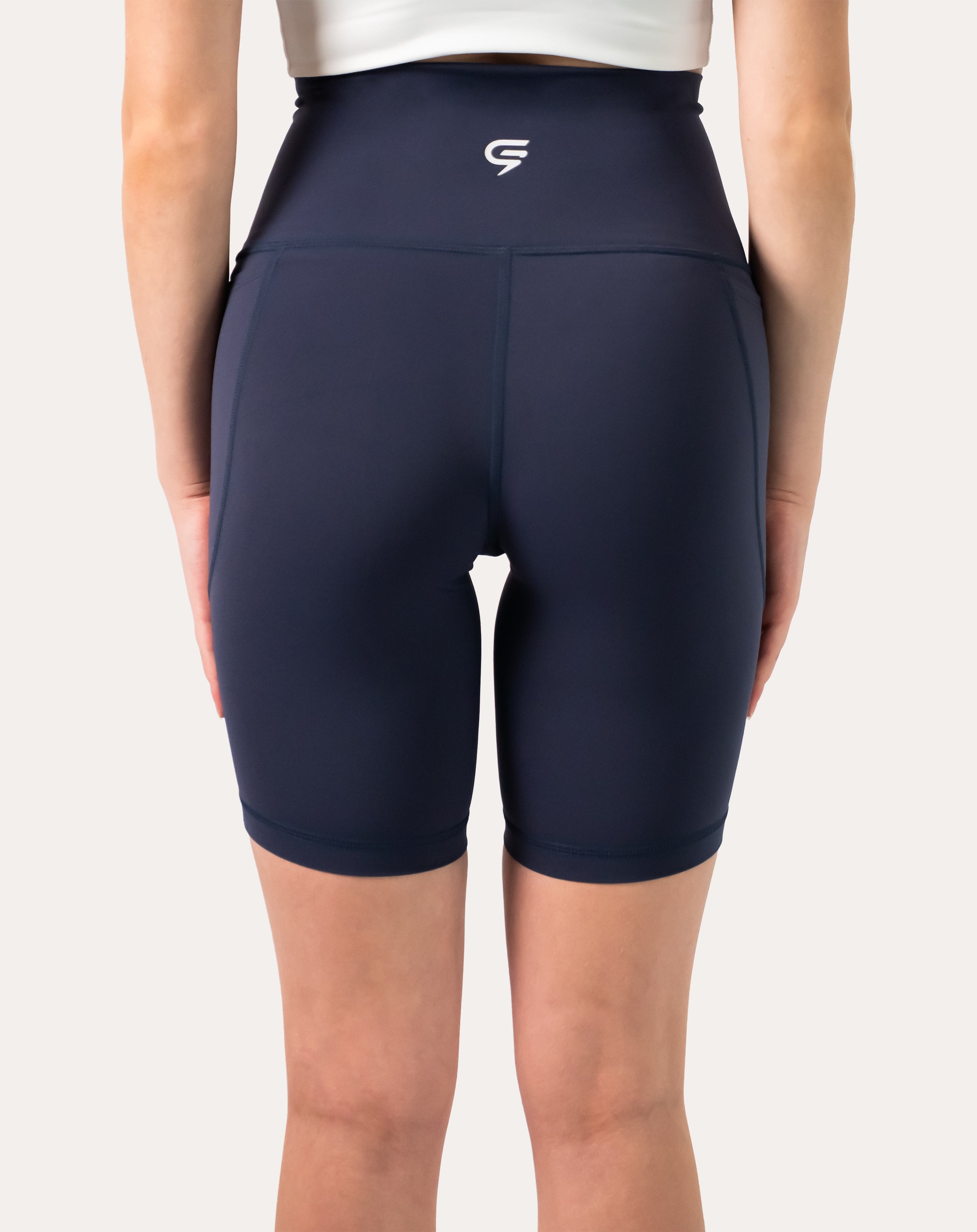 Back close-up of navy high-waist biker shorts with supportive waistband and seams