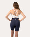 Full-body back view of navy high-waist biker shorts with side pockets
