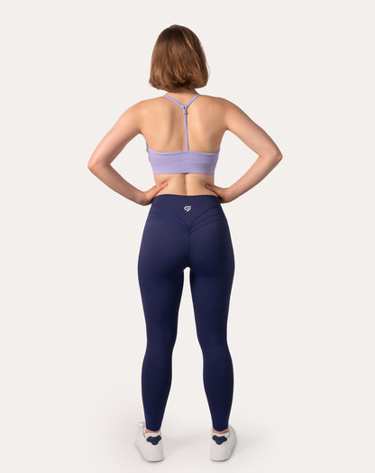 Navy scrunch bum leggings with crossover V-waist and subtle glute-scrunch; back view