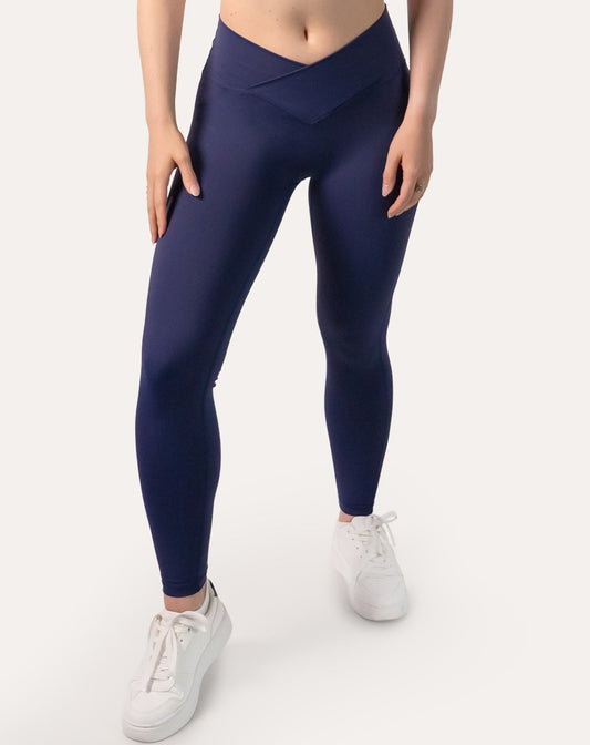 Navy scrunch bum leggings with crossover V-waist; front view, ankle length