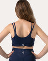Navy sports bra back view with low scoop back and double shoulder straps