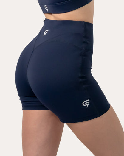 Navy sports bra set side view—focus on matching navy shorts while bra neckline appears in frame