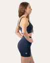 Full-body back three-quarter view of navy sports shorts with high waist and contoured seams
