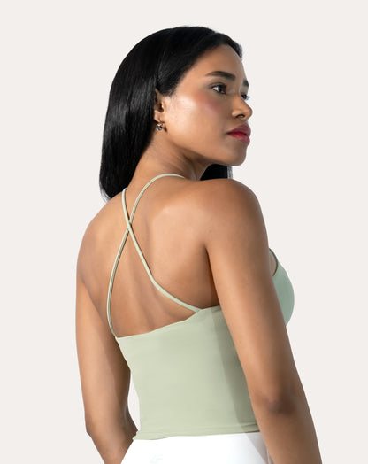 Sage green open back gym top, three-quarter back view highlighting strappy cross-back.