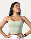 Sage green open back gym top, front three-quarter view with square neckline and thin straps