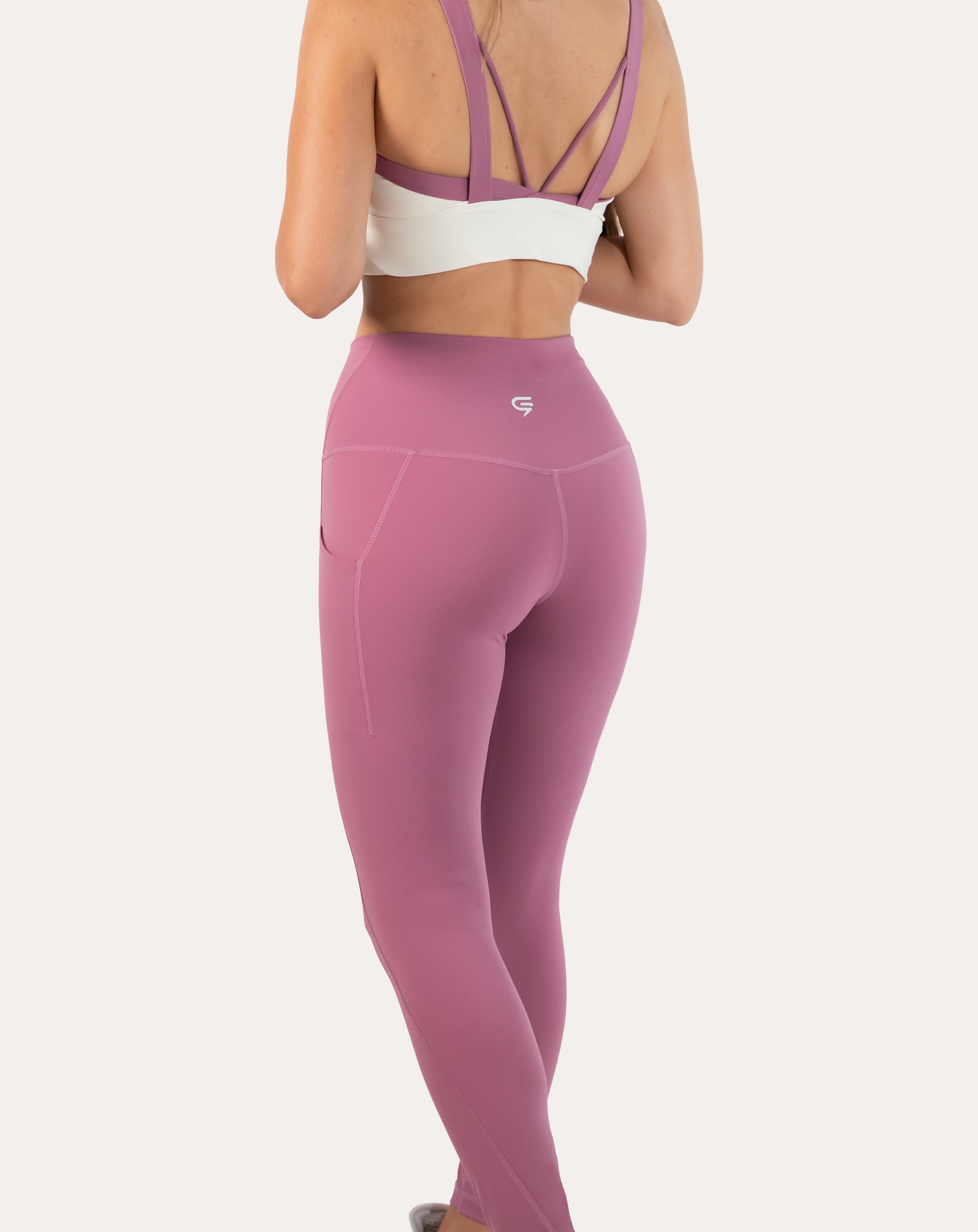Pink leggings with pockets; back waist close-up showing waistband and seams