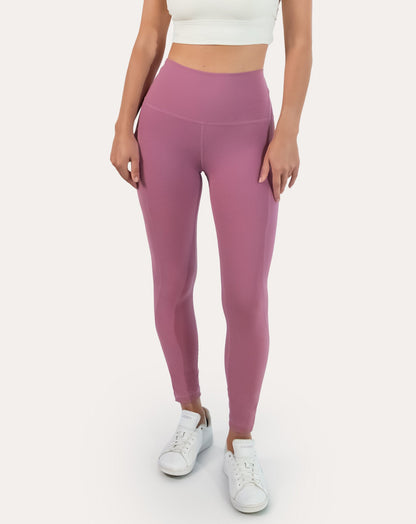 Pink leggings with pockets; front full-length view with high-waist fit