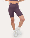 Right front three-quarter view of plum gym shorts with scalloped hem and high waist