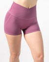 Close-up of plum gym shorts set shorts, V-waist and smooth, squat-safe coverage at hip.