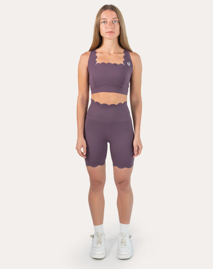 Front full-length view of purple gym set with high-waist biker shorts