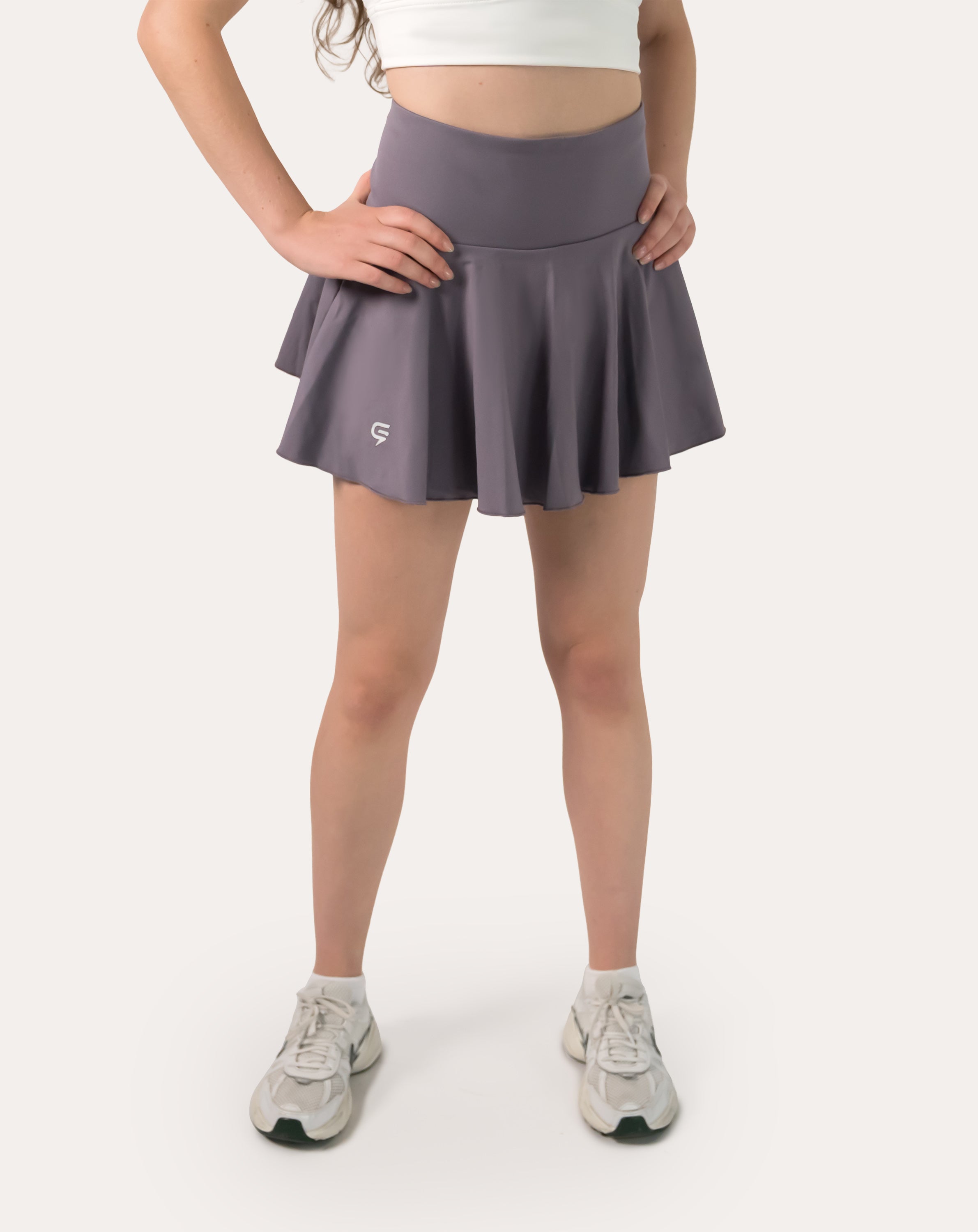 Straight front view of purple sports skirt showing high waist and circle-cut flare
