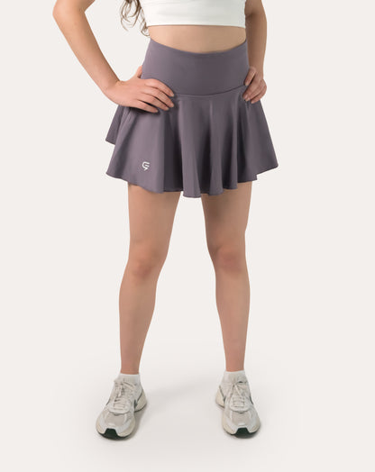 Straight front view of purple sports skirt showing high waist and circle-cut flare