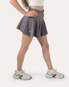 Front three-quarter close-up of purple sports skirt with high-rise waistband and flared hem