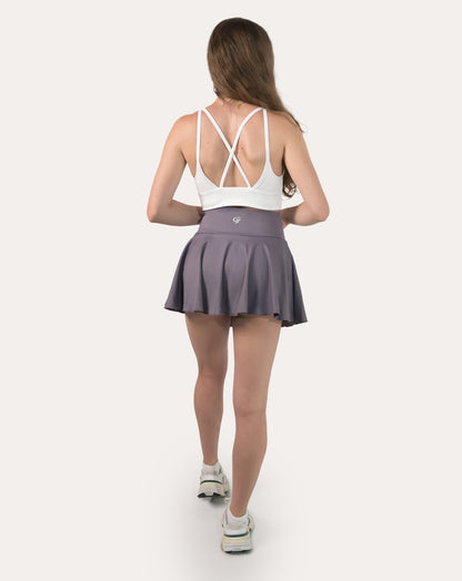 Full-body back view of purple high-waist flared sports skirt