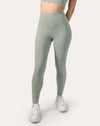 Close-up of sage green gym set leggings, front waistband and sculpting high-rise fit