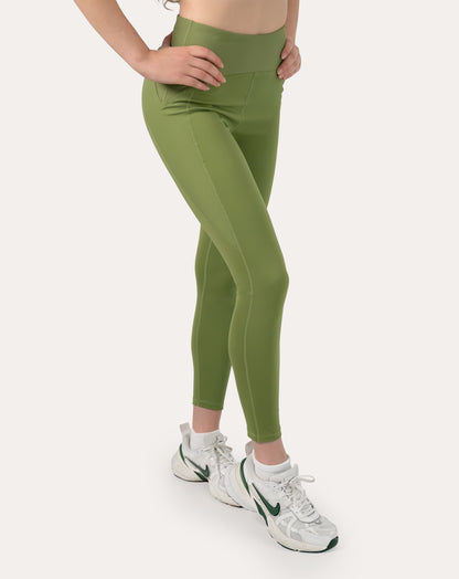 Sage green yoga leggings with V-shaped high waist; right three quarter view