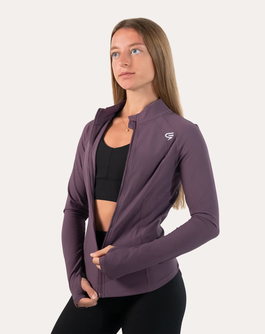Slate-lavender women’s training jacket, hooded, front left three-quarter view with zip partly open