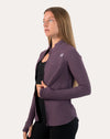 Slate-lavender women’s training jacket in right three-quarter view with hands on hips