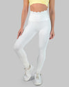 Non see through white leggings with scallop high waisted band, ankle length; front three quarter view