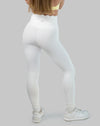 White leggings with high waisted scallop waistband, ankle length; back three quarter view