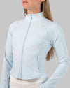 Front close-up of powder-blue track jacket women showing full-zip and stand collar