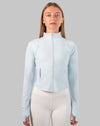 Full-length front view of powder-blue track jacket women with cropped silhouette
