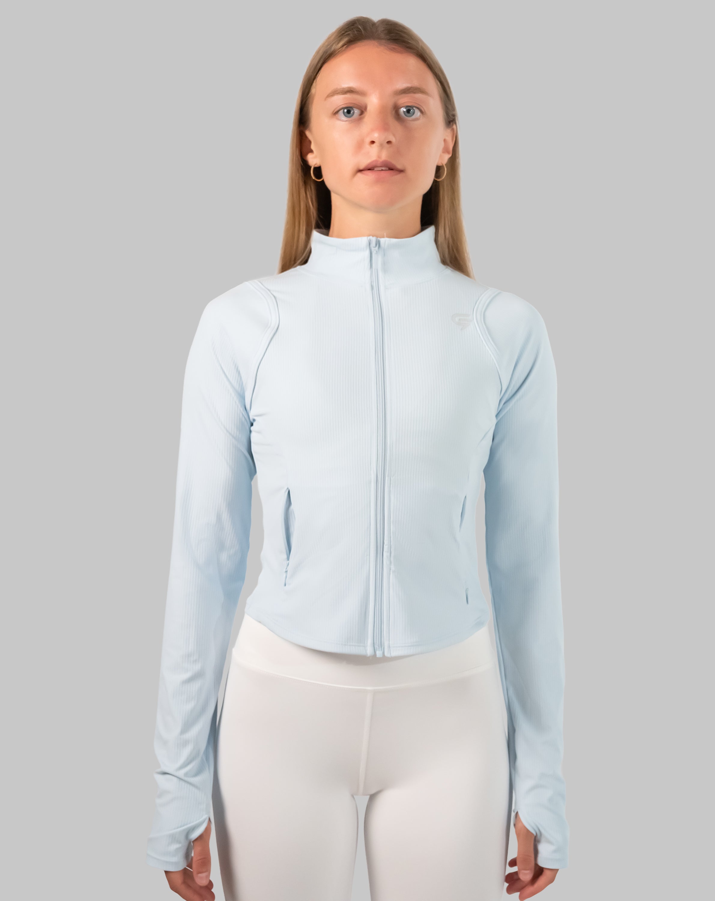 Full-length front view of powder-blue track jacket women with cropped silhouette