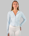 Front view of powder-blue track jacket women with streamlined fit and full-zip