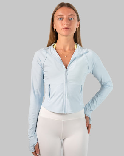 Front view of powder-blue track jacket women with streamlined fit and full-zip