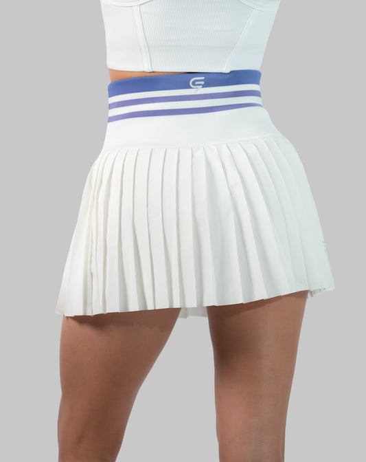 Back close-up of white golf skirt showing striped high-waist band and pleated hem