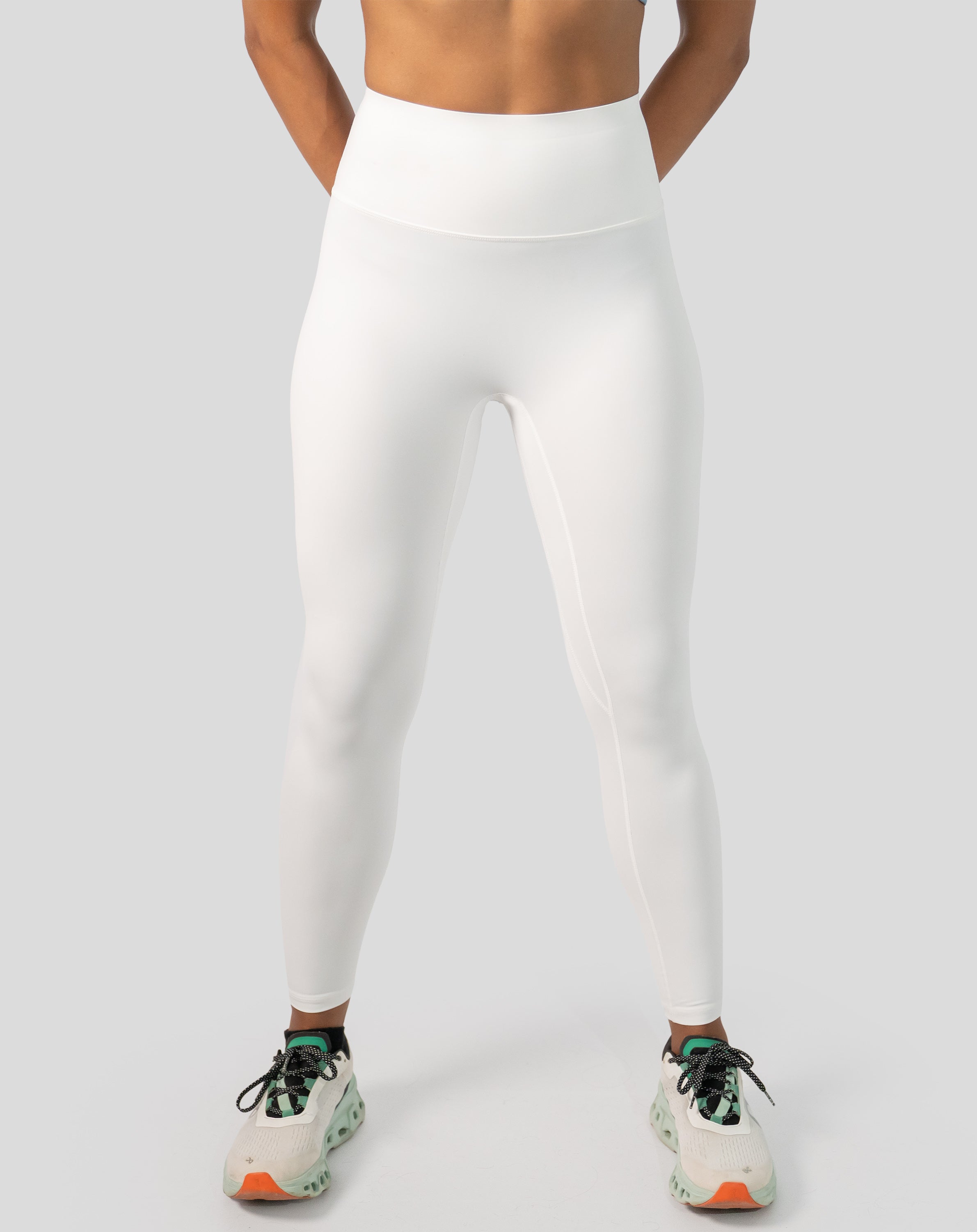 White gym leggings with high waist, ankle length; front view