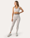 3/4 front pose of white gym set for women with contrast trim and wide waistband
